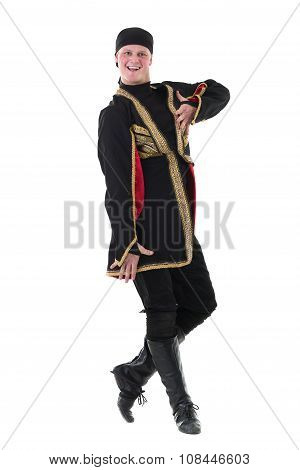 young man wearing a folk costume dancing against isolated white with copyspace
