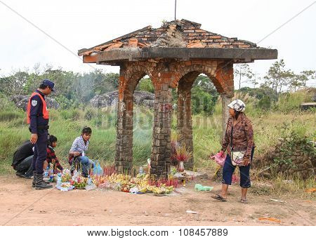 People Praying At The Small Temple