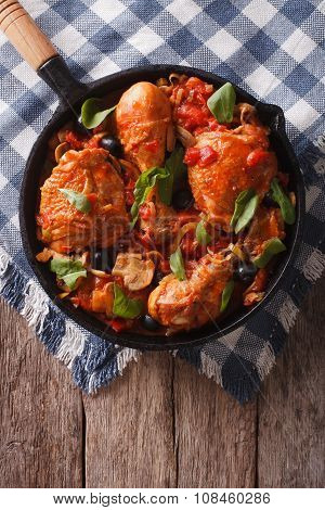 Cacciatori Chicken With Mushrooms And Olives In A Pan. Vertical Top View