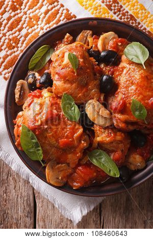 Italian Cacciatori Chicken Closeup On A Plate . Vertical Top View