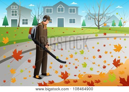 Man Clean Up Leaves During Fall Season Using A Blower