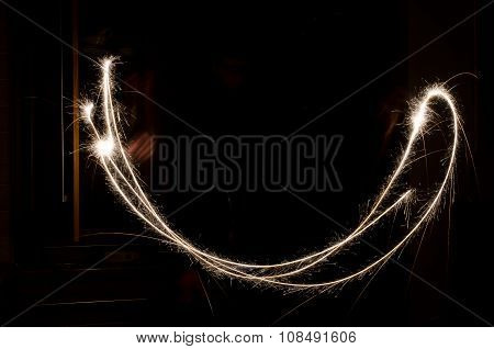 sparkler light trail in dark environment using slow shutter speed