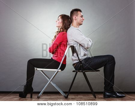 Unhappy Couple Sitting Back To Back. Disagreement.