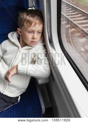 Boy Looking Out Train Window