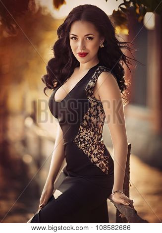 Beautiful young woman with makeup in fashion clothes