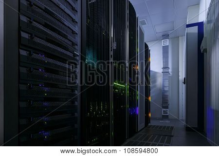 room with rows of server hardware in the data center