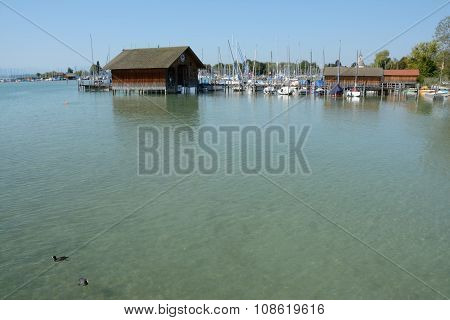 Pier, Marina And Buildings At Chiemsee Lake In Germany