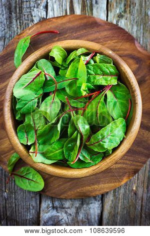 Fresh Chard Leaves In Wooden Bowl