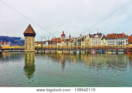 Famous wooden Chapel Bridge in Lucerne Switzerland. Subsequently restored the Kapellbrucke is the oldest wooden covered bridge in Europe as well as the worlds oldest surviving truss bridge