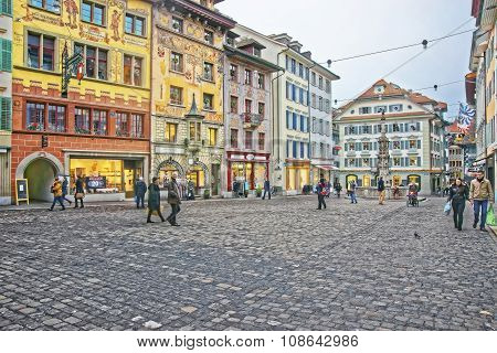 LUCERNE SWITZERLAND - JANUARY 04 2015: Muhlenplatz in Lucerne Old Town with cobbled streets and beautiful medieval houses. This area served as a venue for trade fairs since the 16th century