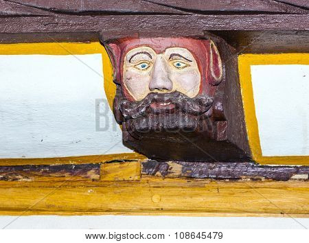 LIMBURG, GERMANY - JAN 4, 2012: wood carving and colored on balk timber of old framework houses