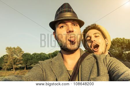 Two Young Hipsters Friends Taking Selfie Outdoor In Holidays - Fashion And Lifestyle Concept - Vinta
