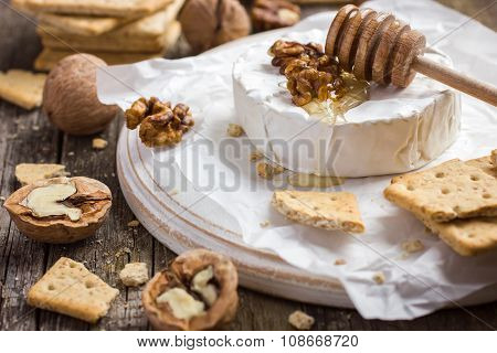 Camembert Cheese With Crackers, Nuts And Honey