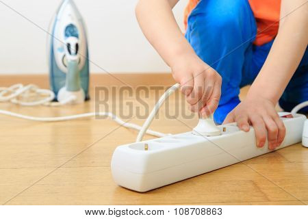 child playing with electricity