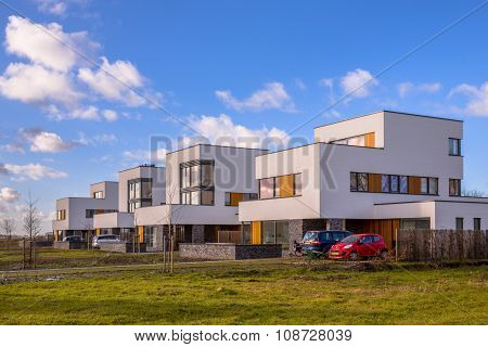 Futuristic Family Houses In A Suburban Street