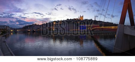 VIew basilica the fourviere and the passerelle du palais de justice over the saone at sunset at Lyon, France