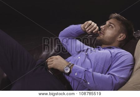 Young man relaxing on a sofa