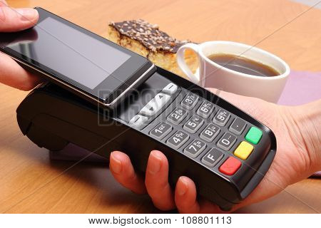 Paying With Mobile Phone With Nfc Technology For Cheesecake And Coffee In Cafe, Finance Concept