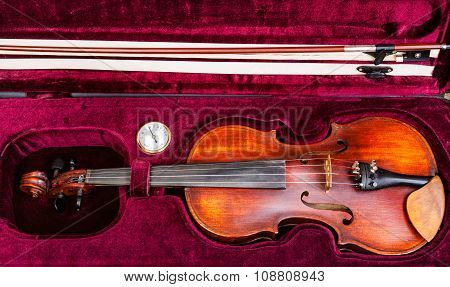 Top View Of Old Violin With Bow In Red Velvet Case