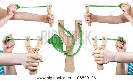 Set Of Female Hands With Wooden Slingshot