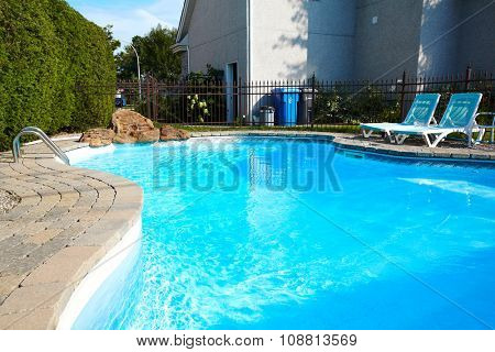 Beautiful swimming pool with a blue clear water.