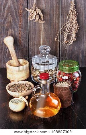 Therapeutic Herbal Tincture, Alternative Medicine, Love Potions, Dried Herbs On A Wooden Table.