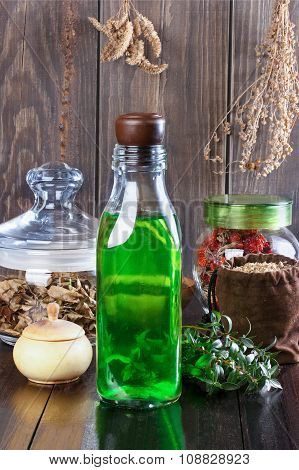 Therapeutic Herbal Tincture, Alternative Medicine, Love Potions, Dried Herbs On A Wooden Table.
