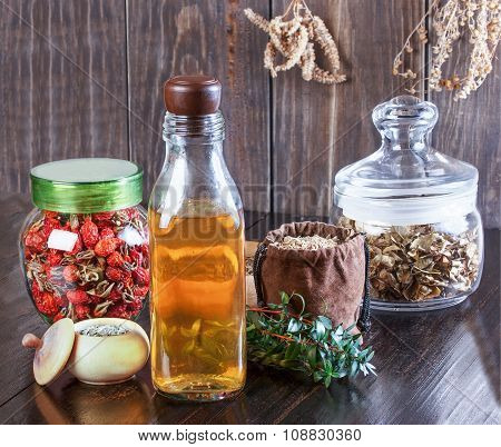 Therapeutic Herbal Tincture, Alternative Medicine, Love Potions, Dried Herbs On A Wooden Table.