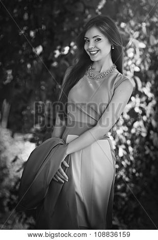Beautiful young  brunette woman in spring garden