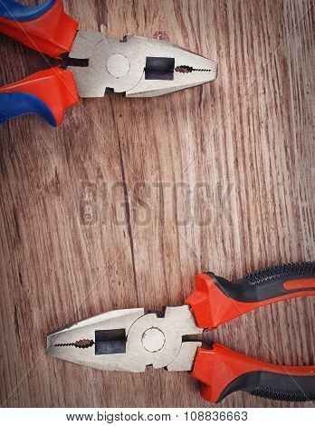 pliers on wooden