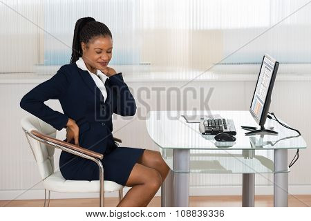 Businesswoman Suffering From Neckache