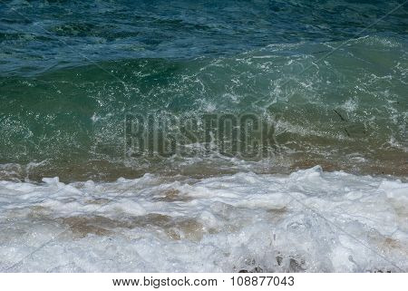 Transparent Deep Green / Blue Wave Of The Sea And That Breaks On The Shore With White Foam
