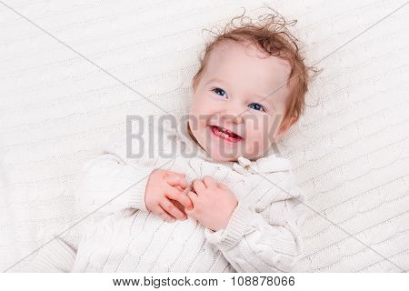 Baby Girl On Knitted Blanket