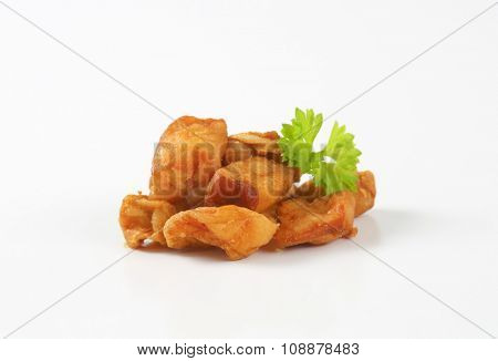 pile of pork greaves on white background