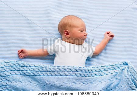 Newborn Baby Boy On A Blue Blanket