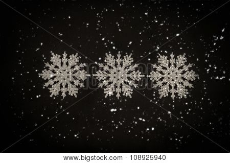 Three white glitter snowflakes