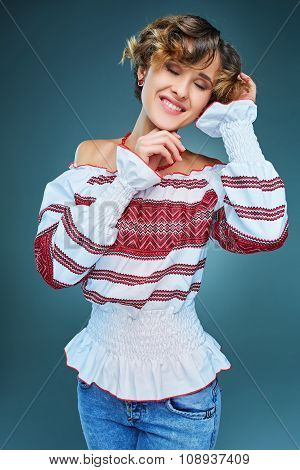 Portrait of young lady with short wavy hair in embroide