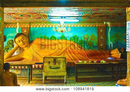 MIHINTALE, SRI LANKA - MAY 8, 2007: relaxing lying buddha in Sri Lanka in artificial light