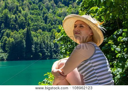 Sitting young tourist looking away