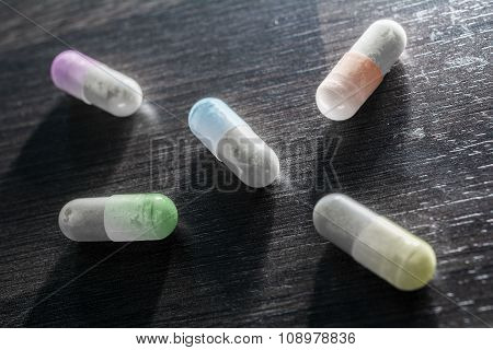 Macro Of 5 Colored Medicine Capsules
