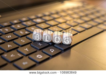 Blog Dices On A Laptop Keyboard