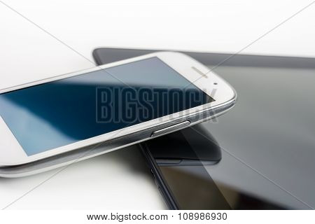 White Smartphone Leaning On A Tablet #3
