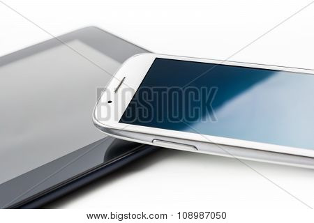 White Smartphone Leaning On A Tablet #2
