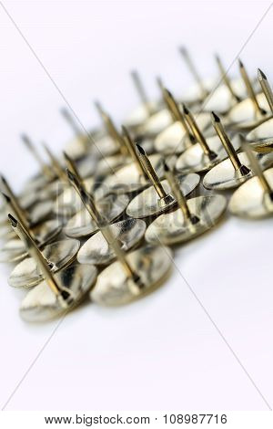 A Medium Collection Of Thumbtacks In A White Box - Crooked Angle