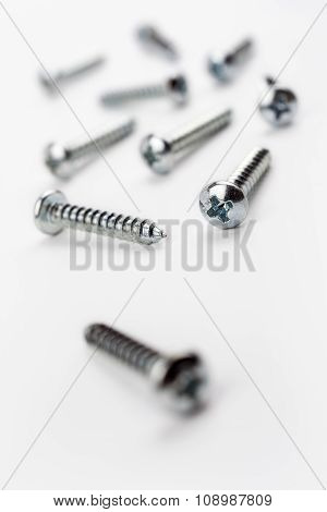 Medium Length Iron Screws In A White Box - Crooked Angle