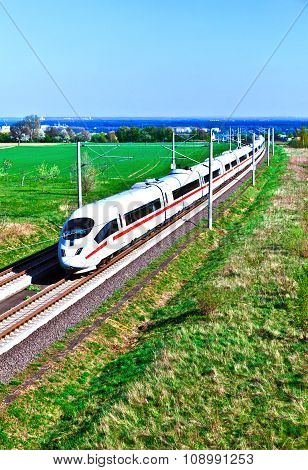 HOFHEIM, GERMANY - FEB 3, 2011: high speed train with full speed in landscape on the way from Frankfurt to Cologne.