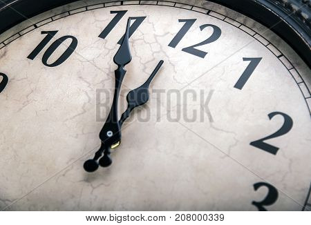 Ancient wall clock. Without five midnight on the clock.