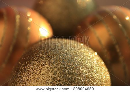 Christmas decorations. Golden balls on the tree. Christmas toys. Gold jewelry with sequins. New year's tradition. To decorate the Christmas tree. Decorate the Christmas tree balls