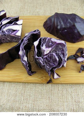 Cutted fresh red cabbage on a wooden board