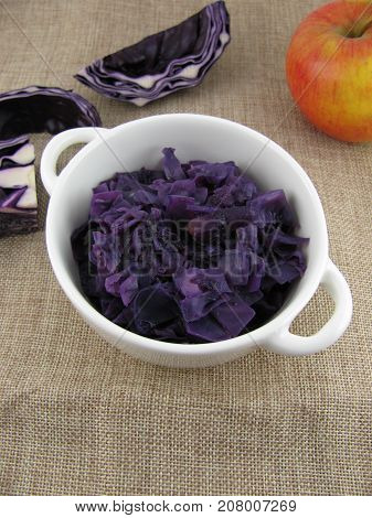 Fresh cooked red cabbage with apple pieces